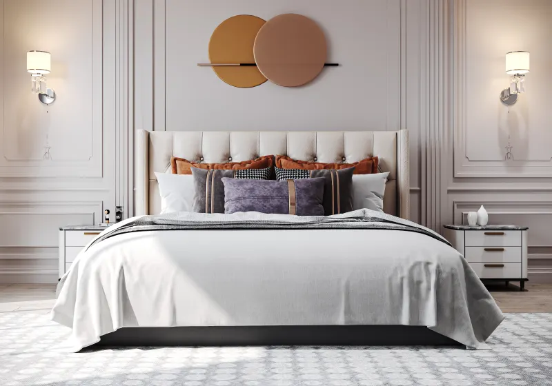 Bed against a white panelled headboard wall in a 2 BHK home in Chandapura, designed by Huma Interiors