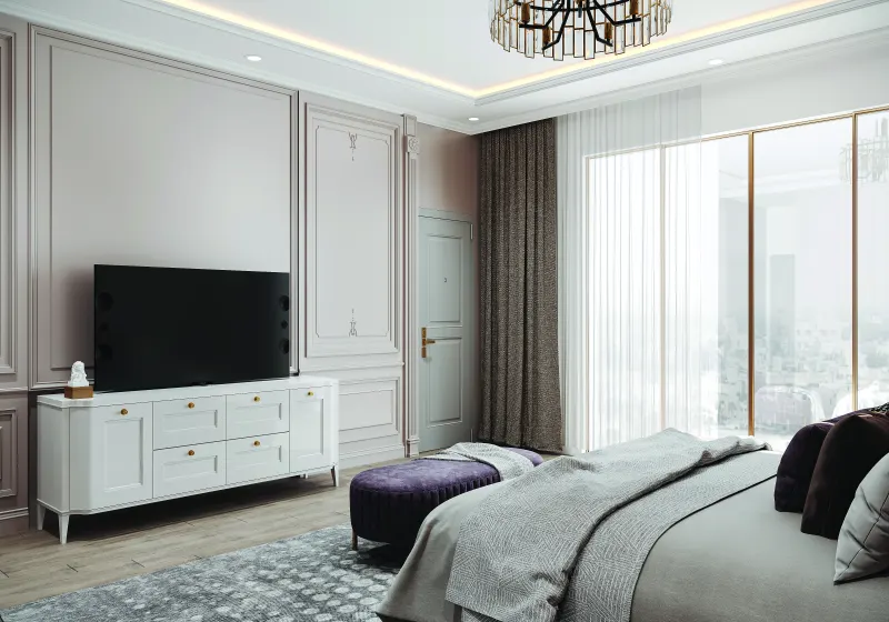 Bedroom TV wall with a white console and panelled walls in a 2 BHK home in Chandapura, designed by Huma Interiors