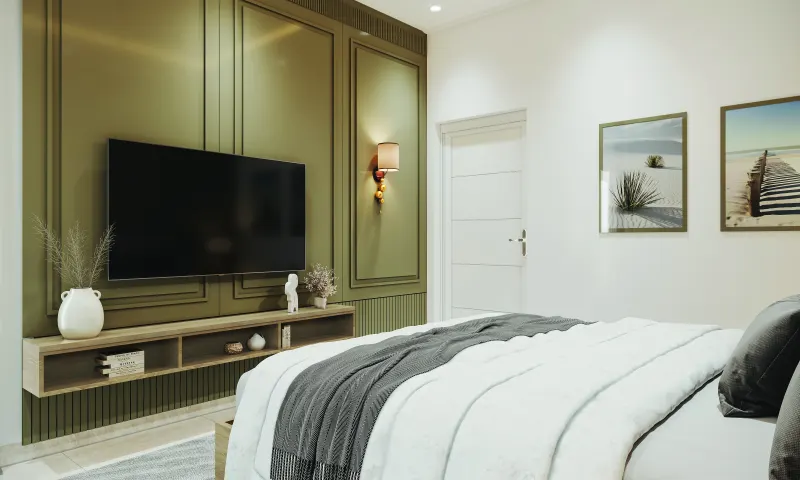 Bedroom with olive green wall panelling and a TV unit in a 2 BHK home in Bagaluru, designed by Huma Interiors