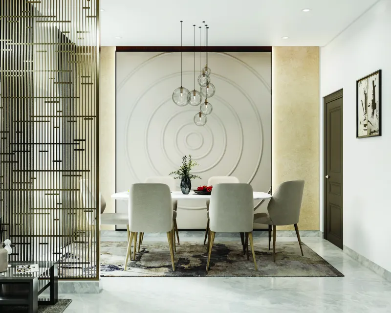 Dining area with a round wall feature and a metal partition screen in a 3 BHK home in Jigani, designed by Huma Interiors
