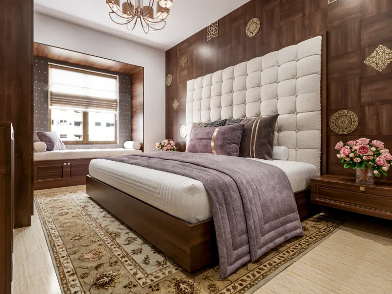 Bedroom with a tall tufted headboard and wooden wall panels in a traditional villa on Sarjapur Road, designed by Huma Interiors