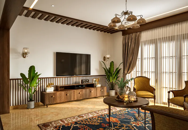 Traditional living room with a wooden TV unit in a villa on Sarjapur Road, designed by Huma Interiors
